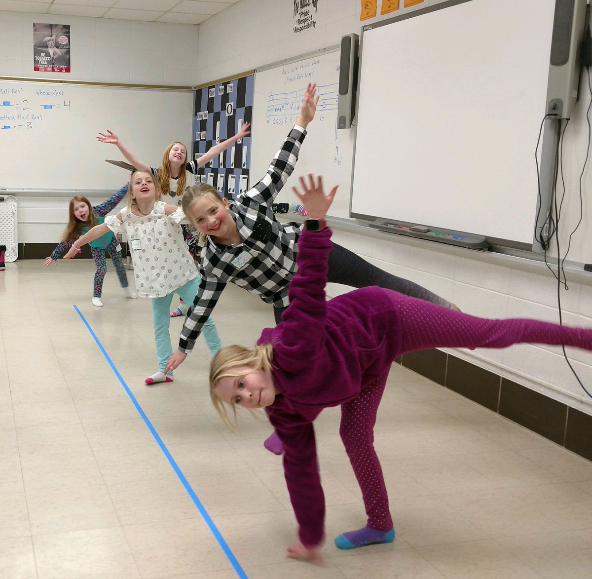 After learning about the Olympic Flag, we learned about the different Winter Olympic sports!  Here is a group of our HL-O Afterschool Adventure youth doing one of their favorite yoga poses - the Warrior 3 - to pose like a figure skater. #UMNExtWorks