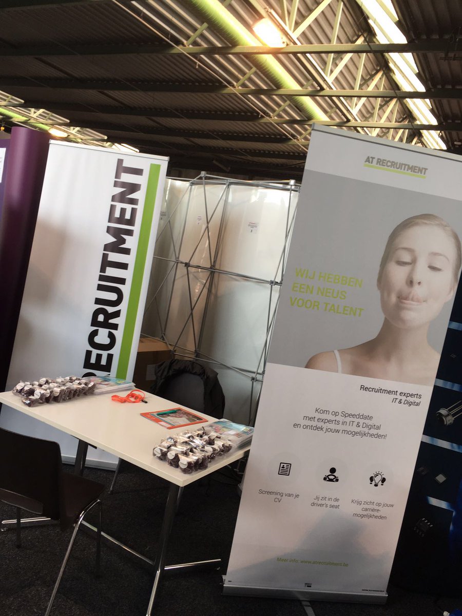 ATRECRUITMENT's tweet photo. AT RECRUITMENT present op de #jobbeurs van #ThomasMore #campusgeel! Kom eens praten met onze recruitment experts in ICT &amp; Digital en krijg zicht op jouw carrièremogelijkheden. Jij zit immers in de driver's seat! 🚘 https://t.co/JzpK1W9M74