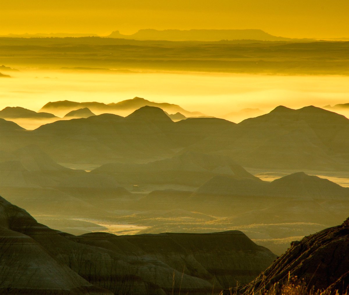 Interior's tweet image. There’s a lot of adventure waiting for you under the golden sun @BadlandsNPS. Pic by Barry Castetter #SouthDakota
