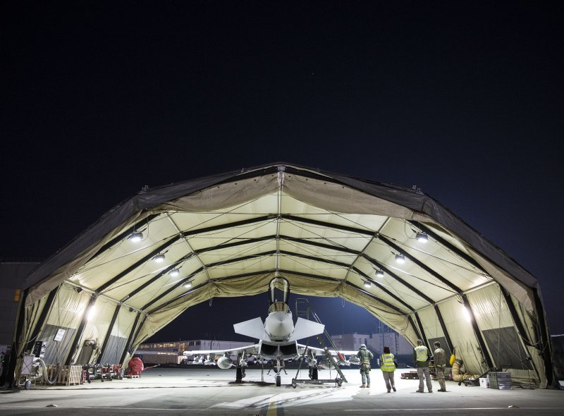 DefenceOps's tweet photo. In the early hours of the morning, aircraft engineers and aircrew make final checks to a Typhoon before she takes off to continue the UK’s efforts against #Daesh #83EAG @RoyalAirForce @CJTFOIR https://t.co/WFLrElQyT8