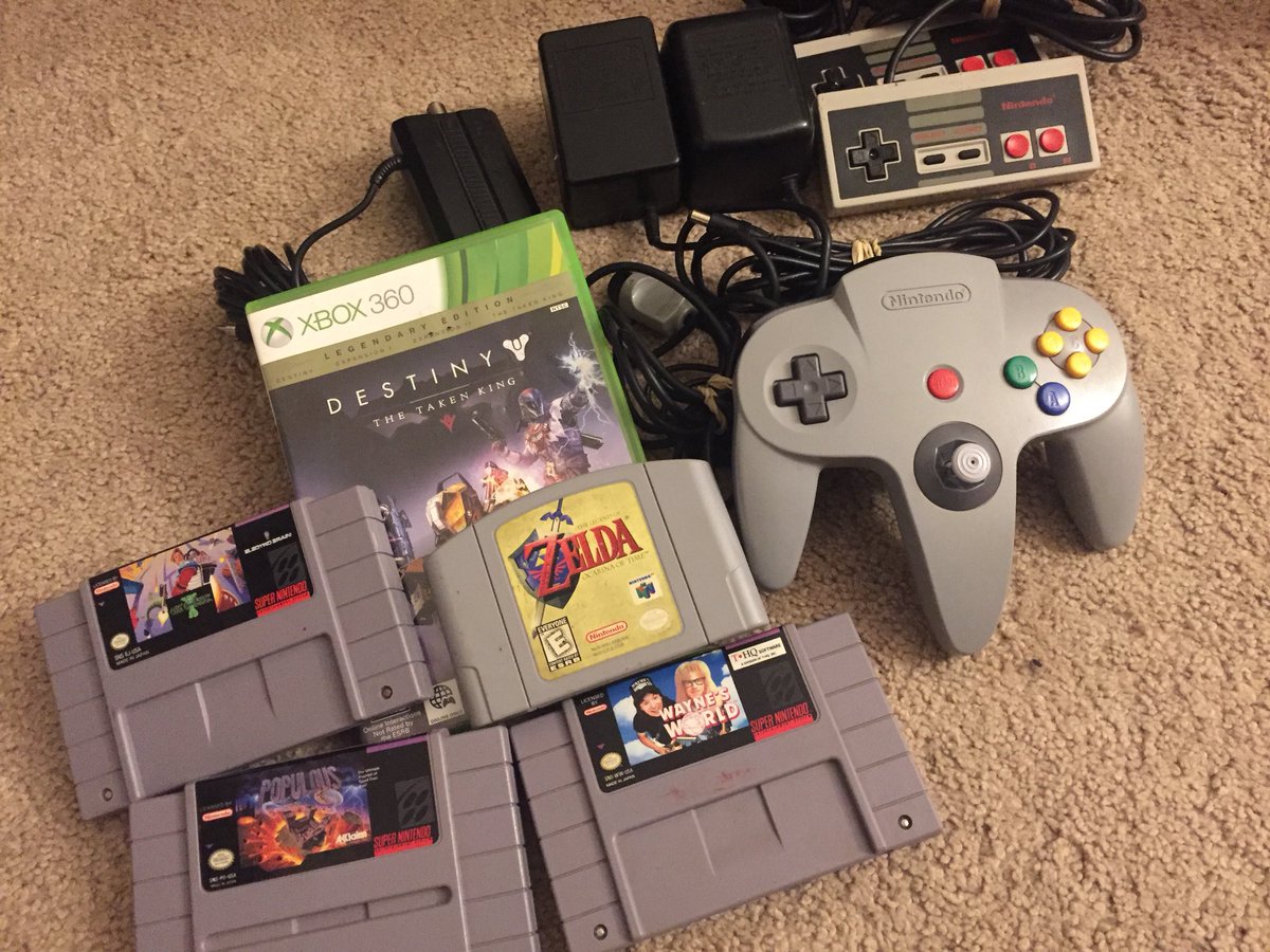 VG_VAULT's tweet image. Thrift shop score last night, I could not believe they had not 1 but 2 copies of Ocarina of Time, the other had a name carved in it. Who does that? The power packs up top are #sega and #nes. #jimpower#populous #waynesworld #mikemeyer #n64 #nintendo #destiny #xbox360 #zelda #retro