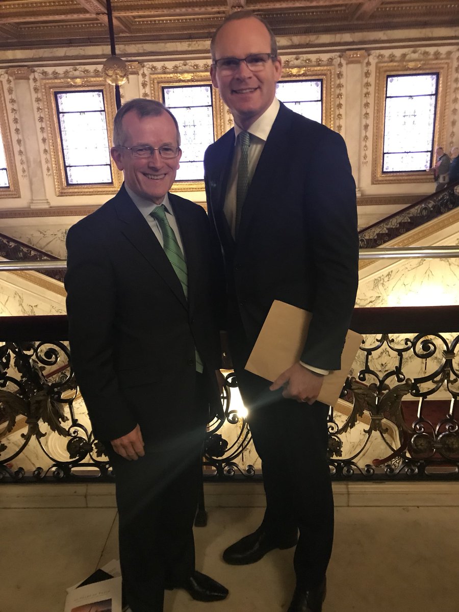NiallGibbons's tweet photo. An honour to introduce Tánaiste @simoncoveney today in New York at the #20yearsofpeace conference. There was a 200 strong audience including Senator George Mitchell to reflect on 20 years of the Good Friday/Belfast Agreement. https://t.co/29lna9v51g