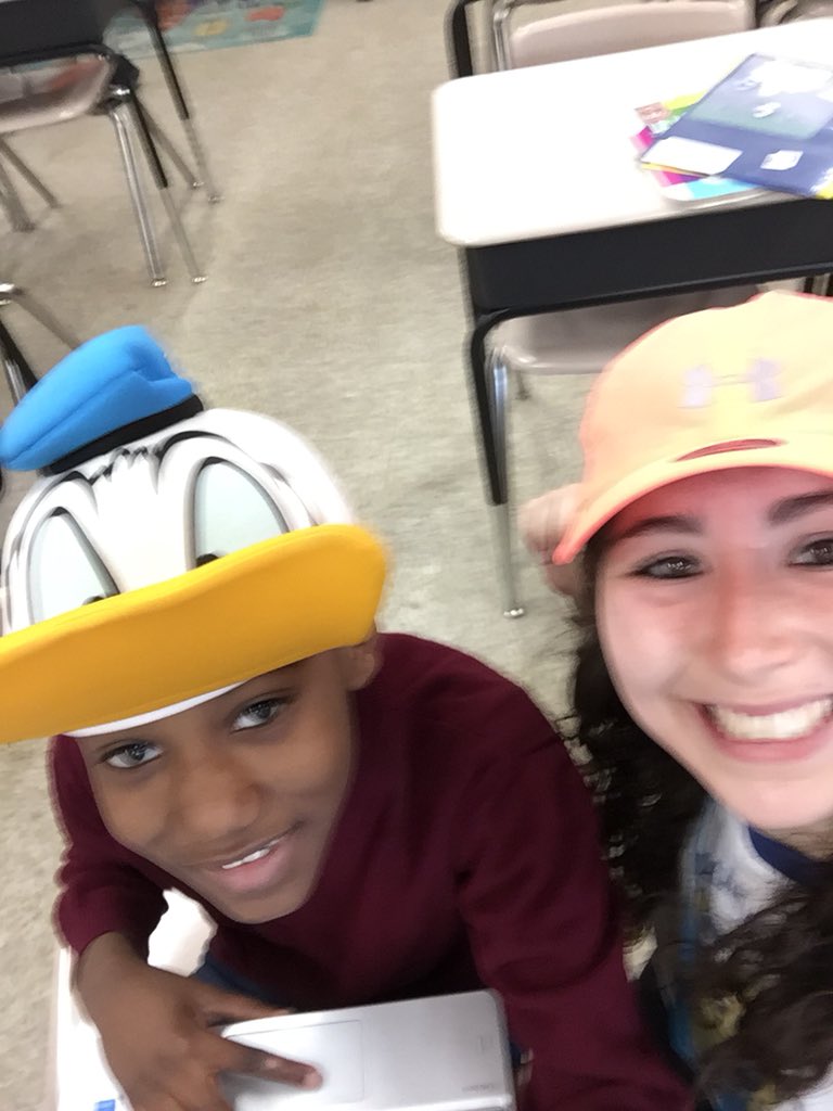 sara_kern2's tweet photo. Hat day to celebrate a successful music class! Check out the mystery reward board behind me in the picture! @srising3 #mysteryrewards #classincentive https://t.co/PNOWlxtTdI