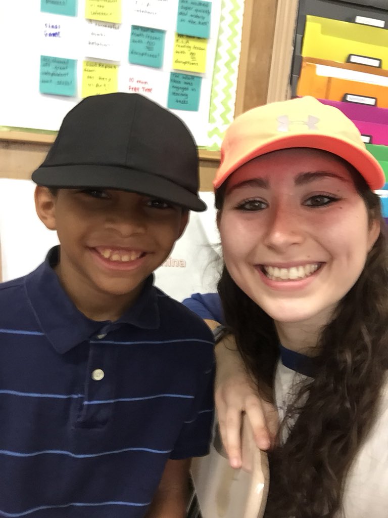 sara_kern2's tweet photo. Hat day to celebrate a successful music class! Check out the mystery reward board behind me in the picture! @srising3 #mysteryrewards #classincentive https://t.co/PNOWlxtTdI