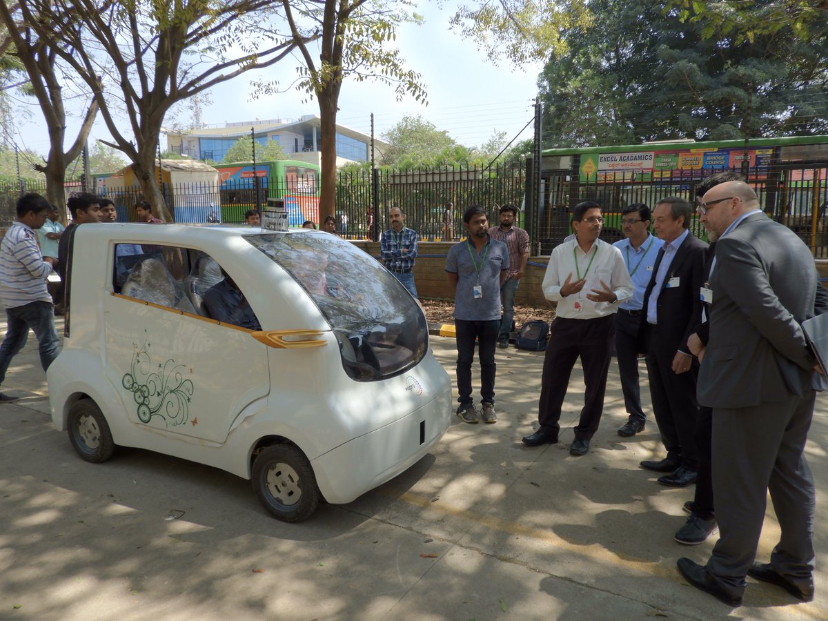 Wipro's tweet photo. Delegates from @NHInsight @John_NH @IvanK_NH and Guy Saunders intrigued with the demo of our #AutonomousCar. #InnovationAtWipro https://t.co/OtrE4J4vhO