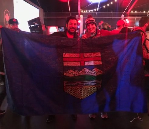 _RicardoYYC's tweet photo. From @2018WoodBuffalo to #Pyeongchang2018! This flag was signed by all the young athletes from Alberta Winter Games (future Olympians) thanking current Olympians 4 blazing the path to the podium! Thx @BobsledKaillie 4 hanging the flag in #CanadaHouse! #ableg #absport #ymm #rmwb https://t.co/j2ZJ9v6m5F