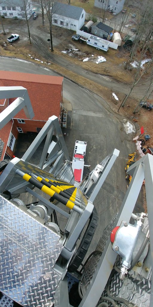 SeabrookNHPD's tweet photo. Thanks to Chief Edwards and the @Seabrook_Fire for taking Lt Gelineau up in Tower-1 during their training Wednesday. #MakingMeDizzy #HangOn #ImNotGettingInThatThing https://t.co/M9iTDUUrHD