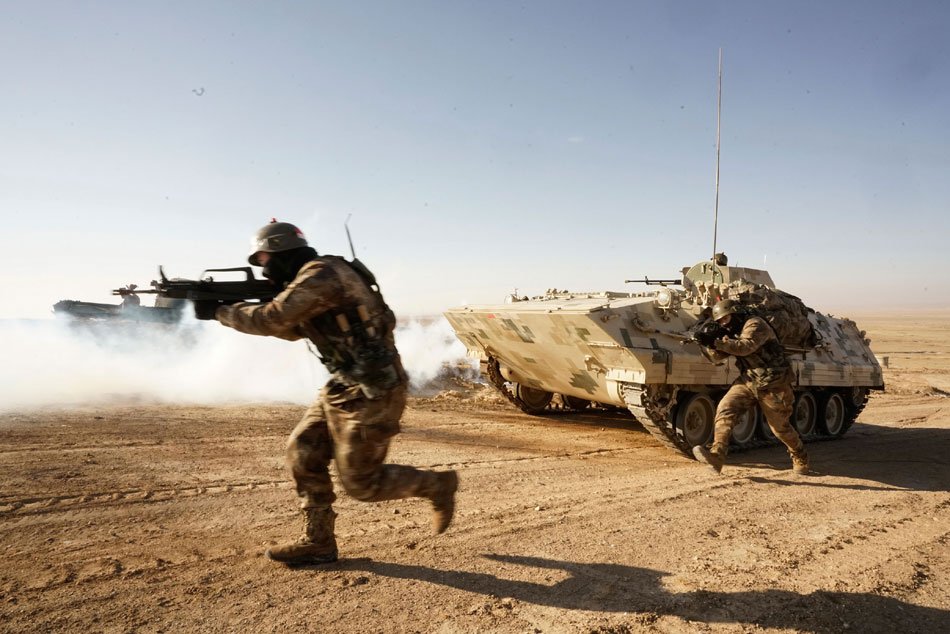 CGTNRadio's tweet image. A combined brigade takes part in a #trainingexercise. The brigade, nicknamed &quot;Plain Wolf&quot;, has participated in over 40 major military confrontation training exercises such as the &quot;Stride-Zhurihe&quot; exercise since it was established 6 years ago. suo.im/1H0KOa