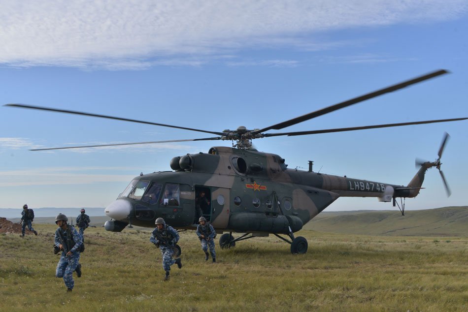 CGTNRadio's tweet image. A combined brigade takes part in a #trainingexercise. The brigade, nicknamed &quot;Plain Wolf&quot;, has participated in over 40 major military confrontation training exercises such as the &quot;Stride-Zhurihe&quot; exercise since it was established 6 years ago. suo.im/1H0KOa