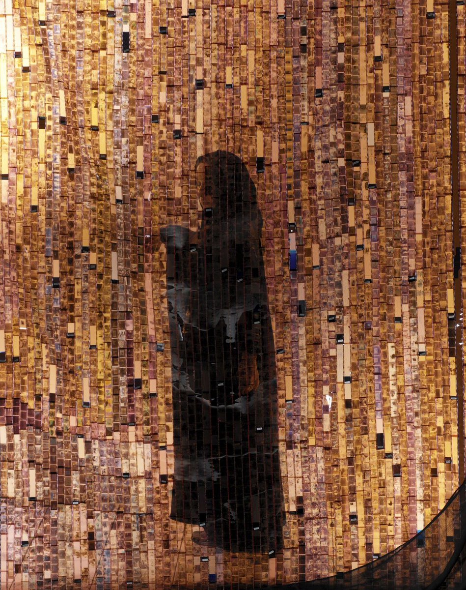 womensart1's tweet photo. Saudi artists and sisters Shadia and Raja Alem, Negative No More (2004), shrouded image through curtain of family photographic negatives #womensart https://t.co/LscLVfqkPQ