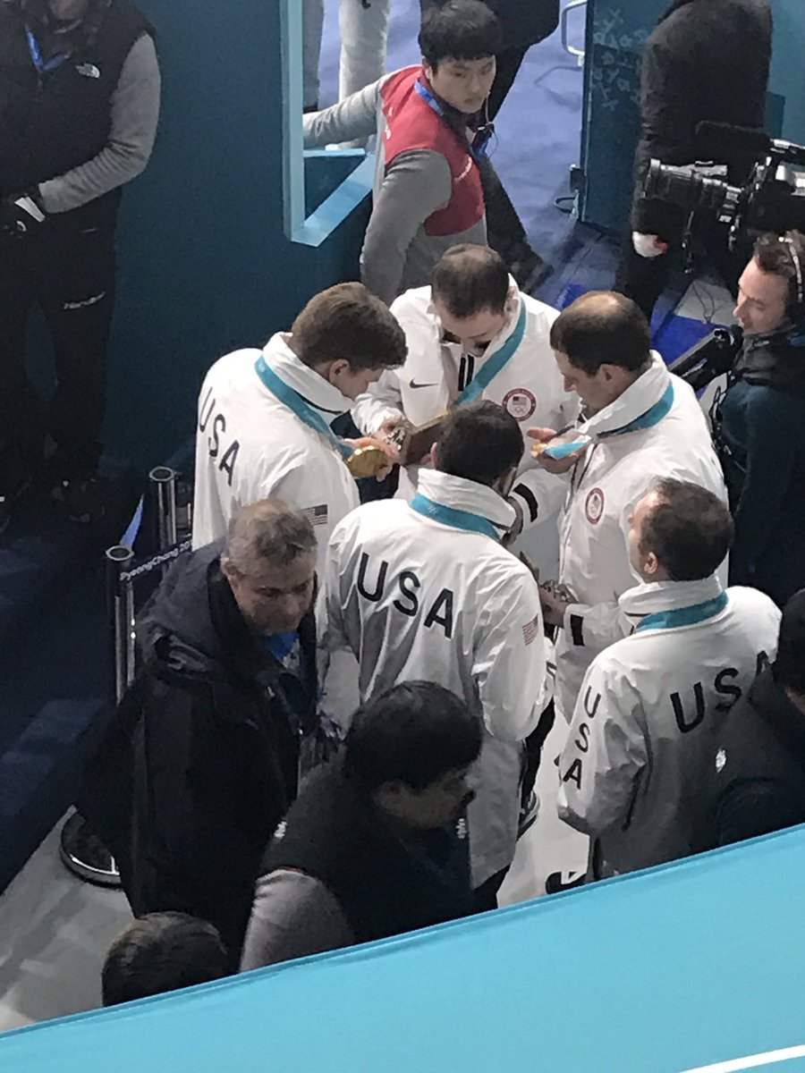 The US men's curling team just realized the gold medals they were awarded moments ago say "women's curling gold medal" on them. Their coaches are working on it ... #pyeongchang2018