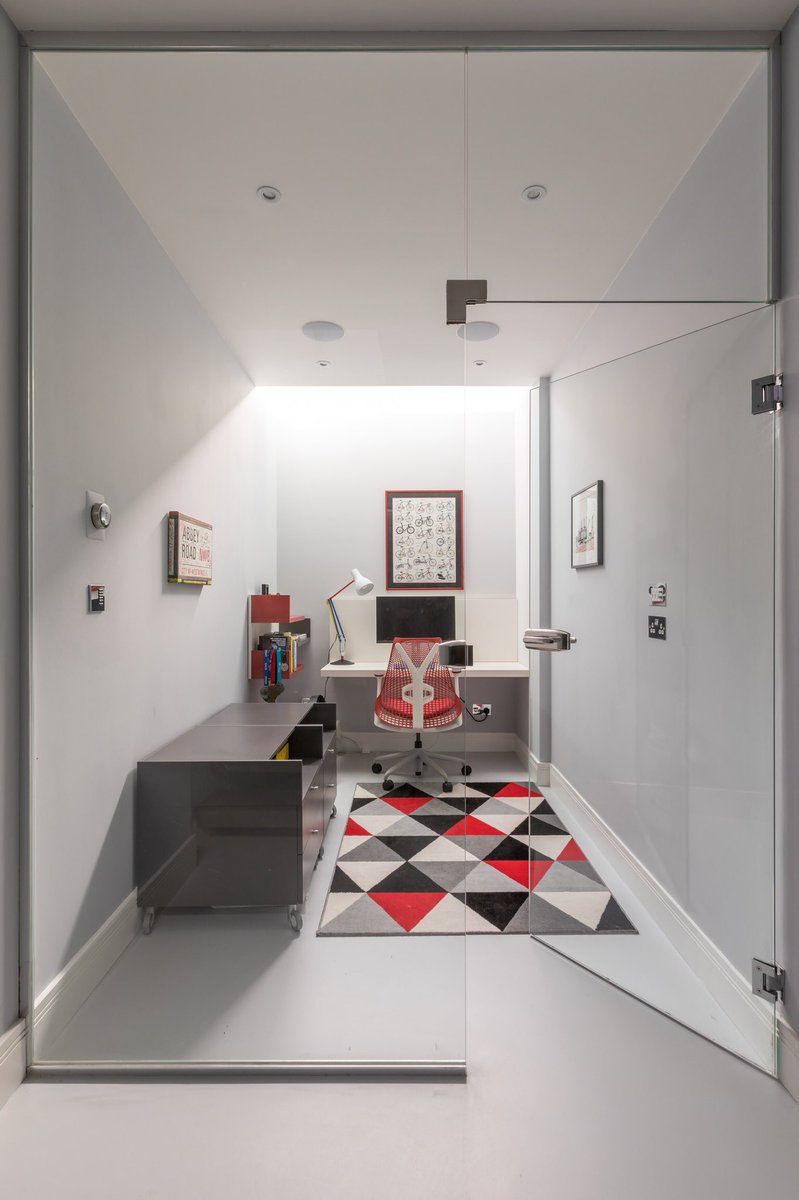 A basement study with resin floors, glass partition, walk on glass #finedecor #londonbasement #basementconversion #basementexcavation #basementextension #claphambuilder #claphamoldtown #londonbuilder