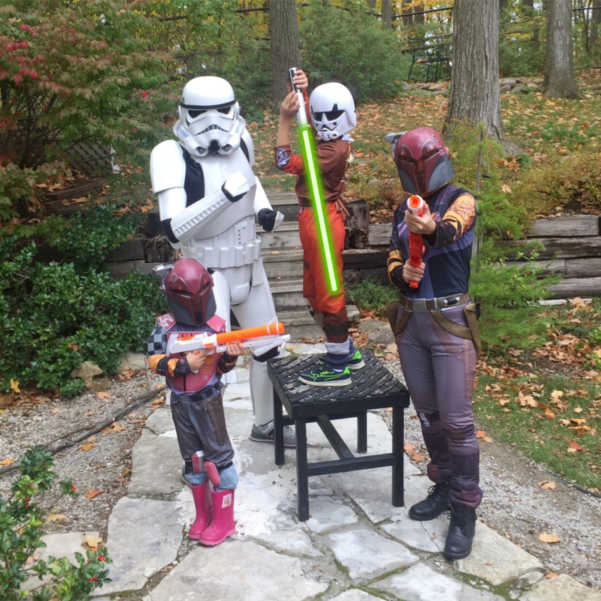 sabre_this's tweet photo. We are a #StarWarsRebels #family! (That’s Kanan in his #Stormtrooper disguise!) Ezra’s lightsaber effect added using our iOS app. Spread the word and help us reach our goal of donating $1,000 to #SickKidsVS by May the 4th! #Sabine #Ezra #GivingBack #SabreThis #communitysupport https://t.co/32AncaU7E5