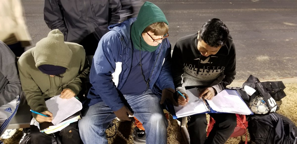 schssoccereagle's tweet photo. Coach Gordon doing homework on the bench with young guys after their big tie at Oakland. https://t.co/6lHS1AnWUx