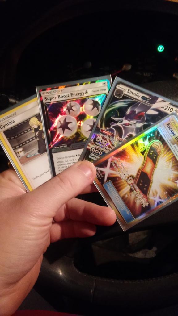 DeathCod25's tweet image. My pulls from last night. Cynthia, super Boost energy Holo rare, Silvally GX, and Escape board secret rare. First box I ever opened for the ultra prism set. @BigJigglyPanda @PokemonBreaks