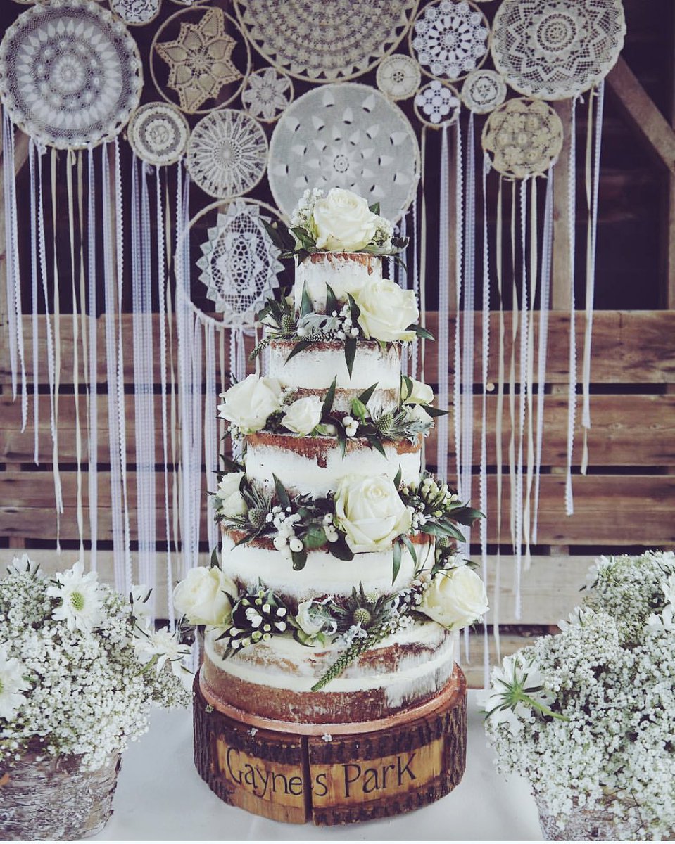 OUTDOOR WEDDING inspiration under the Gather Barn with a gorgeous cake created by <a href="/thecakedoll/">The Cake Doll</a>. Amazing handmade dreamcatcher backdrop by <a href="/Medit_Occasions/">Venue Stylists</a> and ceremony table flowers by @lukeandlottie17 #wedding #WeddingPlanning #boho #romantic #handmade #gaynespark