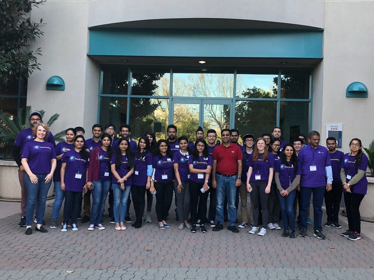 jimitmmehta's tweet photo. Students from #SJSU pose for a picture with SVP @aoswal1234 and take a pose from hacking at #enhack18 #IWDENHack18 https://t.co/XTpX819lDd