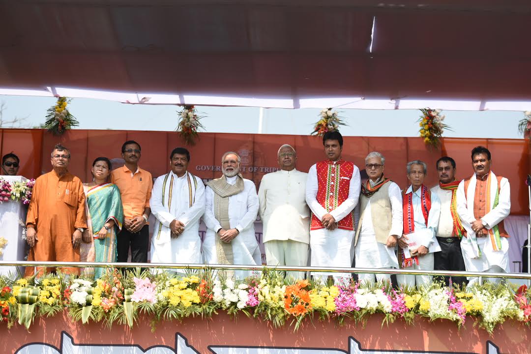narendramodi's tweet photo. Tripura is celebrating Diwali today! The swearing-in ceremony of @BjpBiplab and ministers marks the start of a new era of progress and prosperity. Glad to have joined the ceremony in Agartala today. My best wishes to the team. https://t.co/EIWFx91Xes