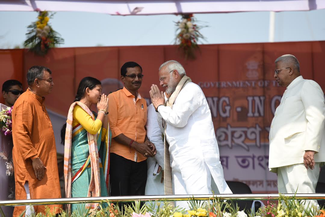 narendramodi's tweet photo. Tripura is celebrating Diwali today! The swearing-in ceremony of @BjpBiplab and ministers marks the start of a new era of progress and prosperity. Glad to have joined the ceremony in Agartala today. My best wishes to the team. https://t.co/EIWFx91Xes