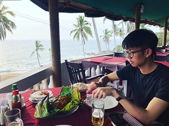 chlocy's tweet photo. our day in emojis: 🌞🌴🐟🍻#incredibleindia @aaronlimzj unwrapping our monster of a meen pollichathu, fish baked in banana leaves with Kerala spices #wordoftheweek #weateitall #bestcoconutriceever #letsgosomewhere https://t.co/Hk0kEeLjqk