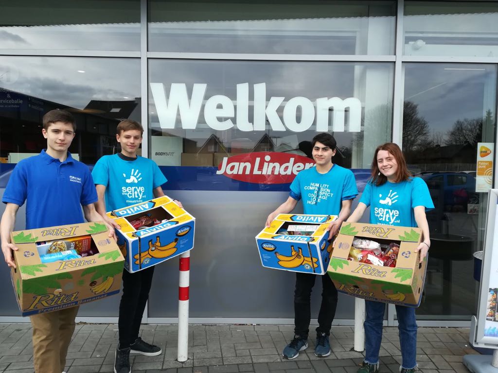 UWC_Maastricht's tweet photo. On this @NLDOET many of our MYP4&5 & DP students volunteer with @STCMaastricht on the #Ympact Food Bank project to collect items in the stores and distribute them in #maastricht #servethecity #uwcwithnldoet #servicelearning #celebratingcommunity @OranjeFonds @UWC_IO @UWC_NL https://t.co/zYXoRibaH4