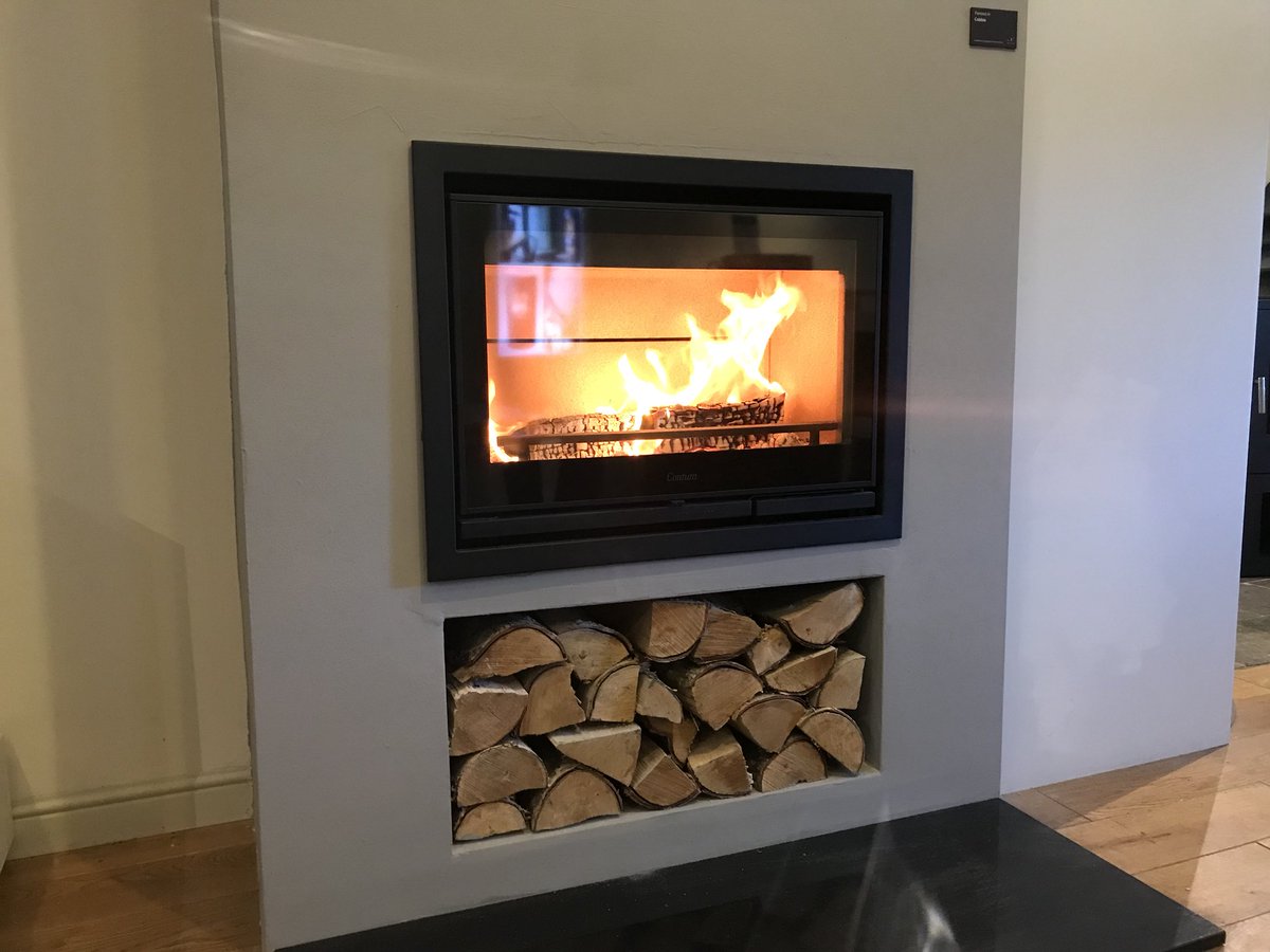 Topstak's tweet image. The new @ConturaStoves i7 burning beautifully in our showroom with feature #logstore and granite #hearth