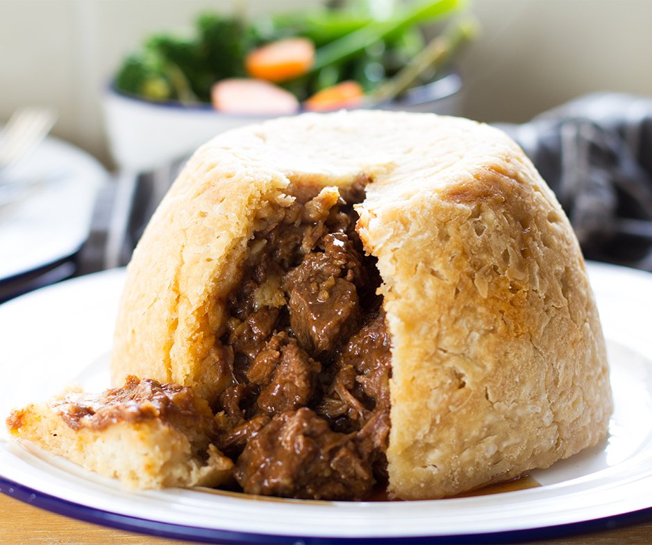 Pudding or Pie?

An office war has broken out whether this is a Pie or a Pudding. Please help us settle the debate once and for all.