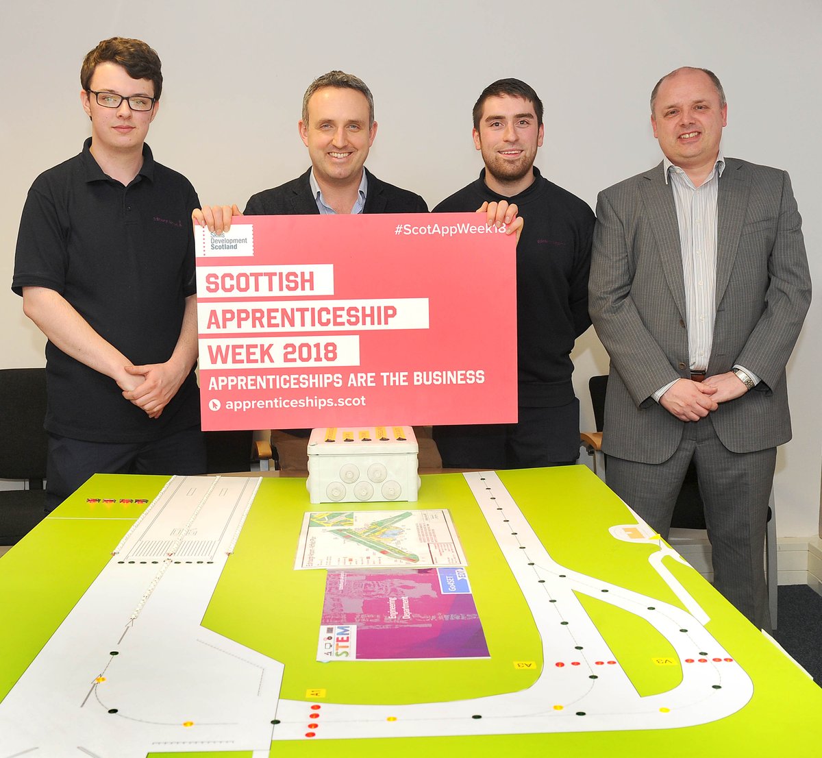 EDI_Airport's tweet photo. Our engineering apprentices welcoming @agcolehamilton to the airport earlier, showing off their model runway as part of #ScotAppWeek2018. We're proud to play a part in developing the young workforce! https://t.co/pUApSUzHHx