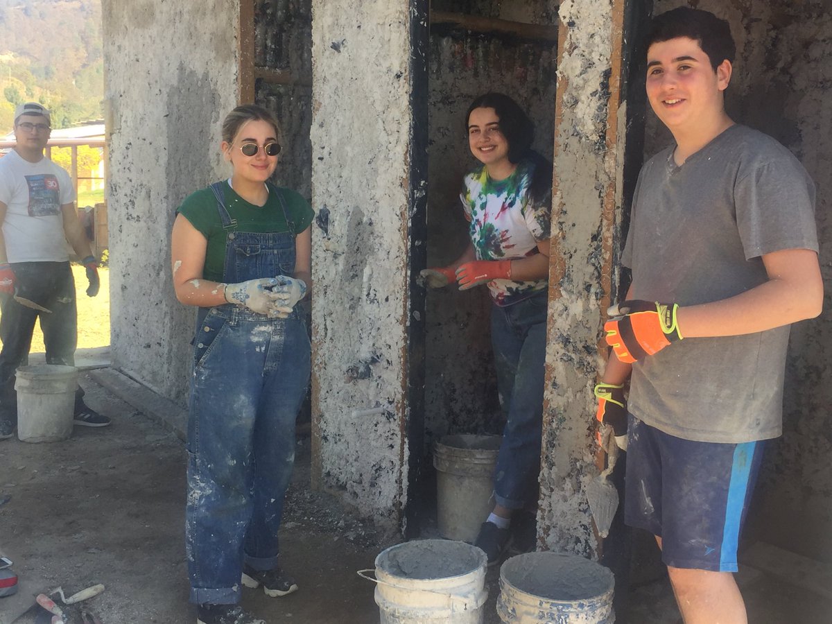 It is too bad that we use drywall at home and do not make walls from cement and plastic dirt and garbage filled bottles - we have some experts whose skills may end up going to waste. This is hard work and apparently fun!