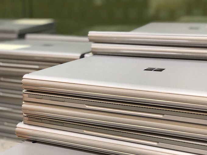 Several piles of Microsoft SurfaceBooks