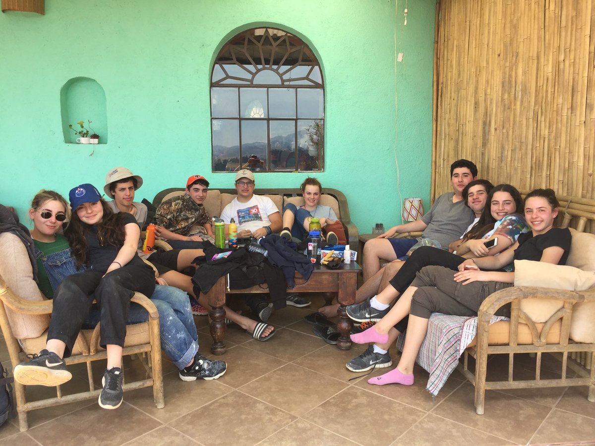 A little break on the deck after lunch before the final work shift of this trip begins. I will text the view they have from their seats next. It is incredibly special, add in the warmth of the sun and great company - it is a perfect lead into our community Shabbat.