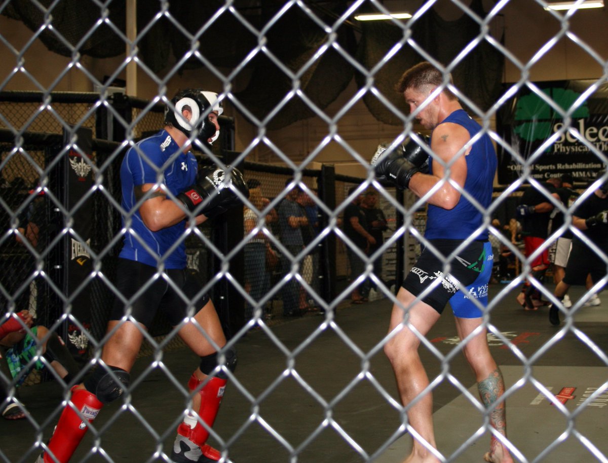 iammrlights's tweet photo. .@MMAjunkieRadio My favorite @Mike_Pyle memory... it's 2011 first time I've watched him train. I sit down and see this #MulletMaster smearing his training partner into the cage with knees and punches. Was so intense I forgot to pull up my camera until I could breathe. #ThanksMike https://t.co/R3egggdjuF