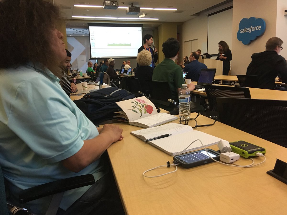 An image of a woman sitting at a table.