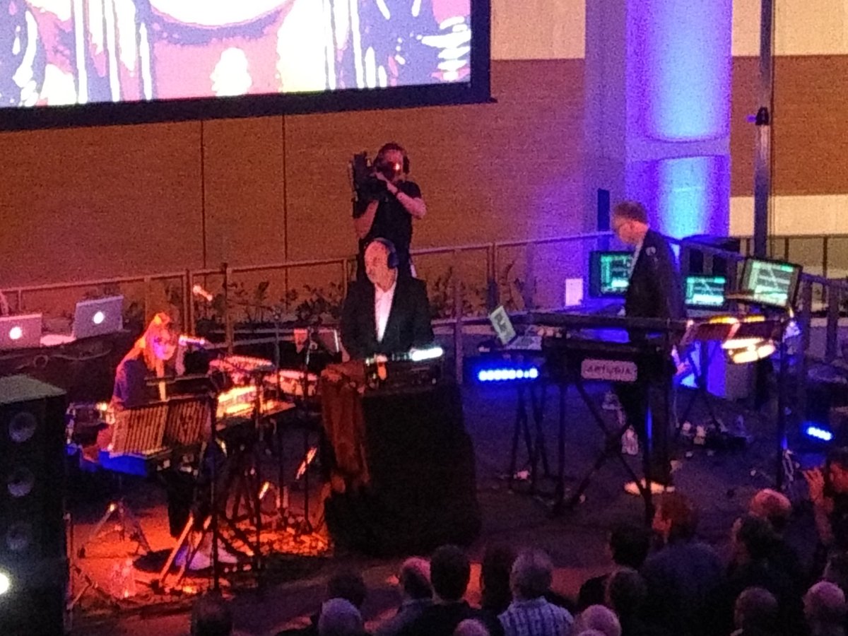 Tamzin_online's tweet photo. @artofnoiseoffic as the image of a group playing live @britishlibrary earlier tonight. Dudley-Jeczalik-Langan triumph with their #InVisibleSilence reboot! My first gig at a Library too, seems a totally suitable venue for AON though. Immensely Enjoyable! 😎🎭 #ArtOfNoise #London https://t.co/IBK8x7YHkF
