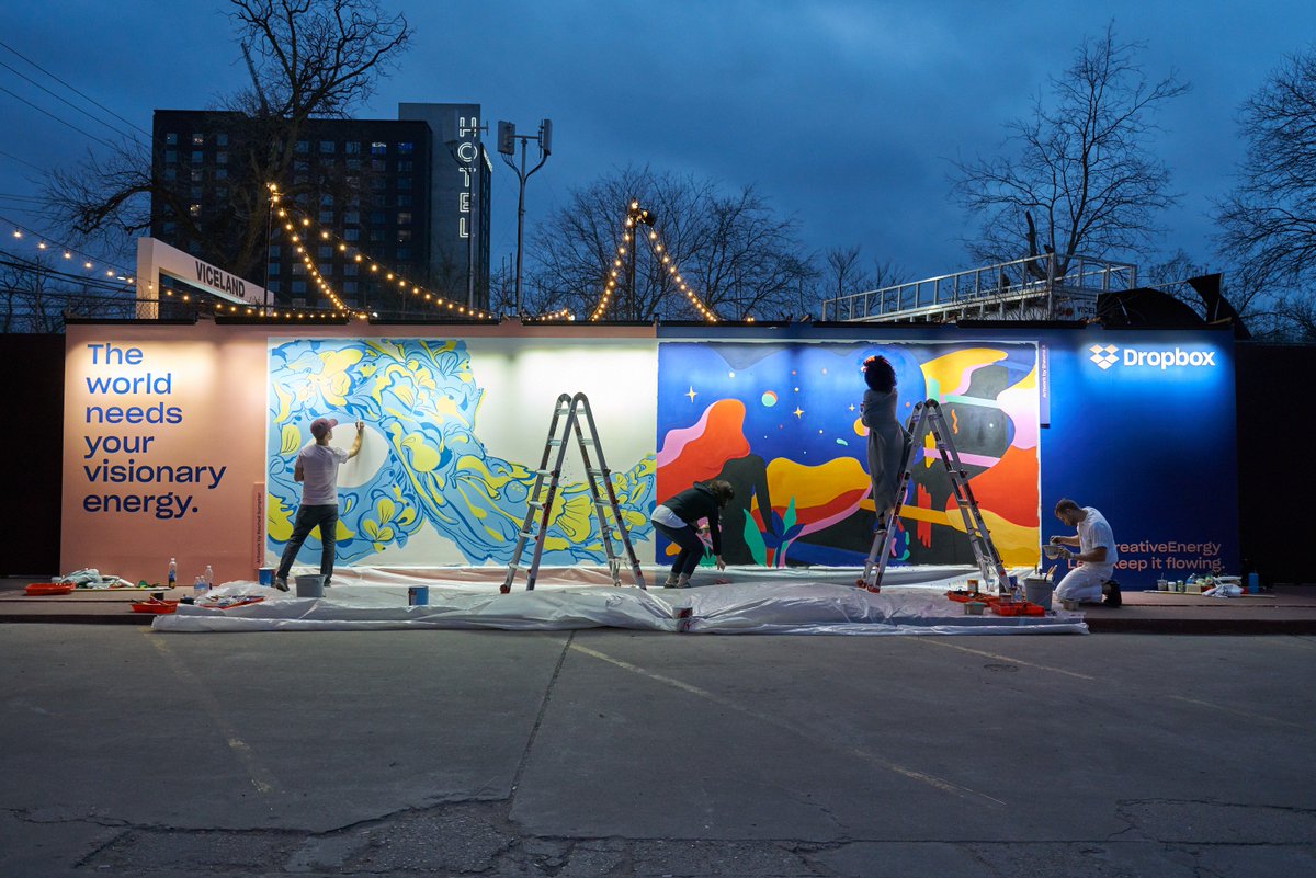 Dropbox's tweet photo. At #SXSW today, artists @shawnax and Rachell Sumpter brought the theme, Reimagining the Future, to life. While they each have their own visions of how to portray the future, they collaborated to create one cohesive work of art. #CreativeEnergy https://t.co/YkWyoEDzZI