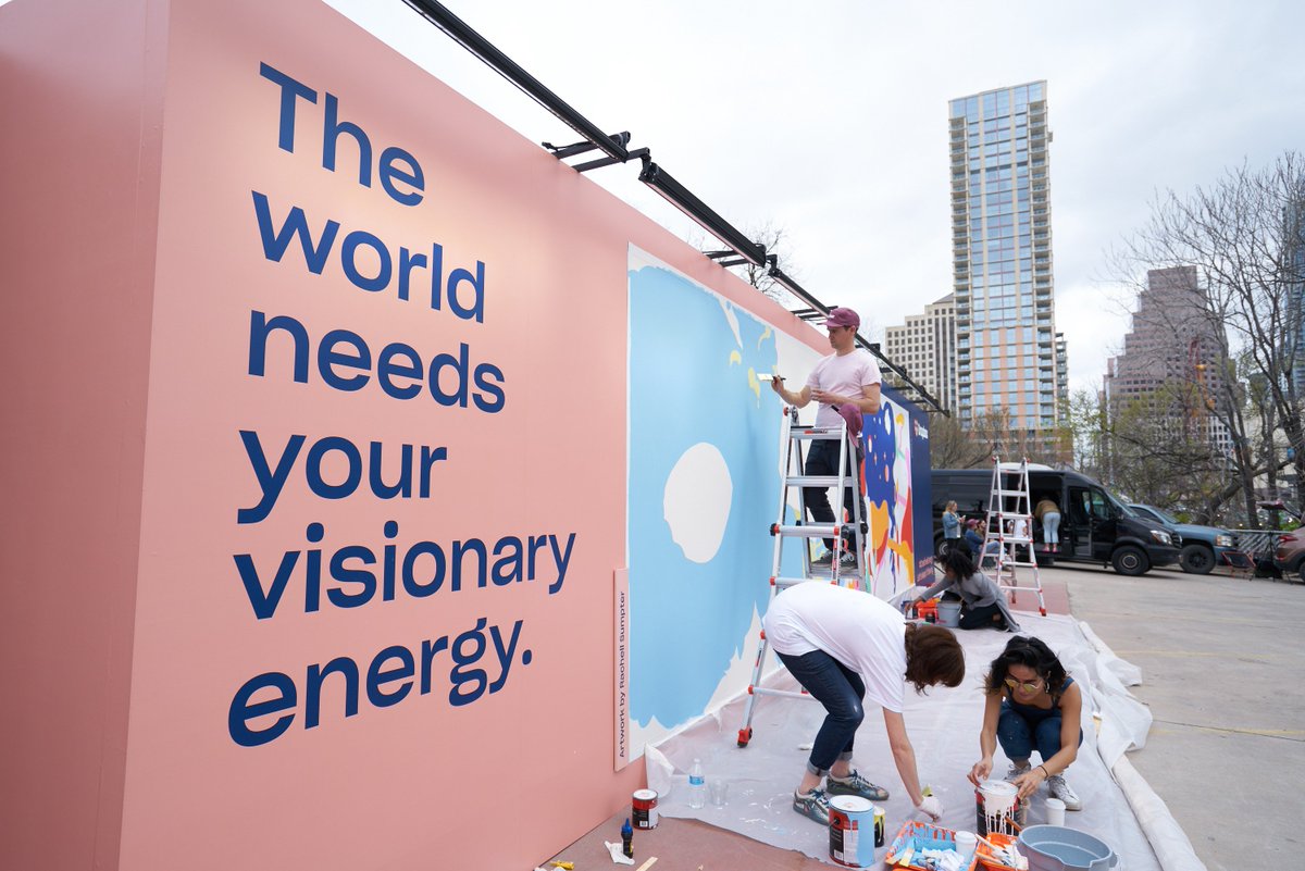 Dropbox's tweet photo. At #SXSW today, artists @shawnax and Rachell Sumpter brought the theme, Reimagining the Future, to life. While they each have their own visions of how to portray the future, they collaborated to create one cohesive work of art. #CreativeEnergy https://t.co/YkWyoEDzZI