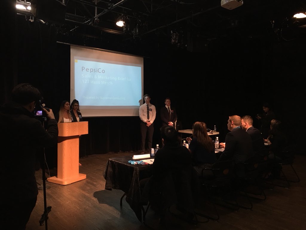 SFUSMA's tweet photo. First team out of our three finalists to present is Supreme Consulting. Their main focus is on millennials and offering free products with purchases. @PepsiCo #SMACKDOWN2018 https://t.co/R3s99LLRn6