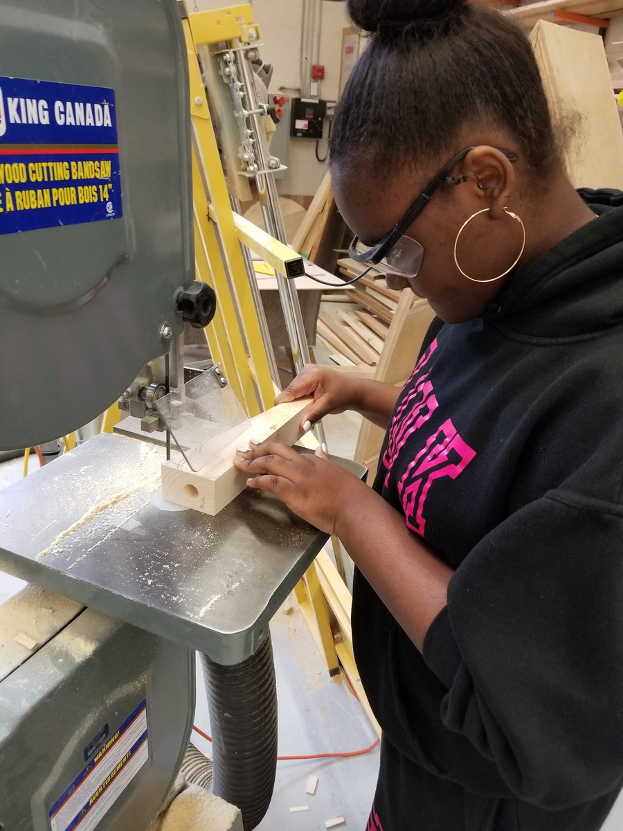 Mrs_Crognale's tweet photo. @fmssarrows Grade 9 students on the bandsaw cutting out their C02 Race cars! Stay tuned for the races shortly after #marchbreak!! #construction #racecar #students #tech #exploringTECH https://t.co/Ts1QfDx6SO