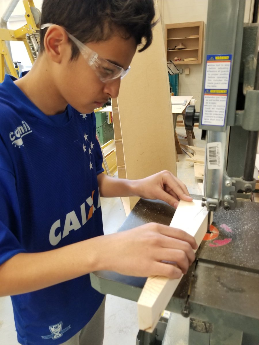 Mrs_Crognale's tweet photo. @fmssarrows Grade 9 students on the bandsaw cutting out their C02 Race cars! Stay tuned for the races shortly after #marchbreak!! #construction #racecar #students #tech #exploringTECH https://t.co/Ts1QfDx6SO