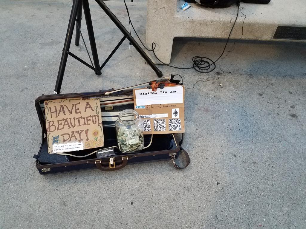 Elias_Redbeard's tweet photo. Another day out on the pier! #busking #bitcoin https://t.co/oZAH8b2SEV