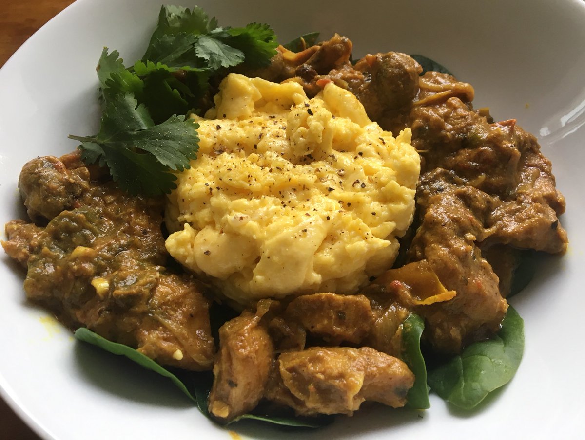 TheLCHFChef's tweet photo. Leftover lucky-dip from the freezer for breakfast 😀 Spicy Indonesian Chicken curry served on a bed of raw spinach , with creamy scrambled eggs and garnished with fresh coriander.  The perfect start to the weekend ! It was hot, hot, hot ! 🌶 https://t.co/xslsCxYbhR