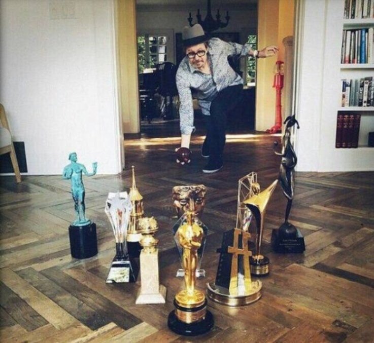 DennisTheIntern's tweet image. I don’t know if this picture of Gary Oldman using his numerous awards as bowling pins is cool or douchey. Thoughts? #pbrposse #awardsbowling