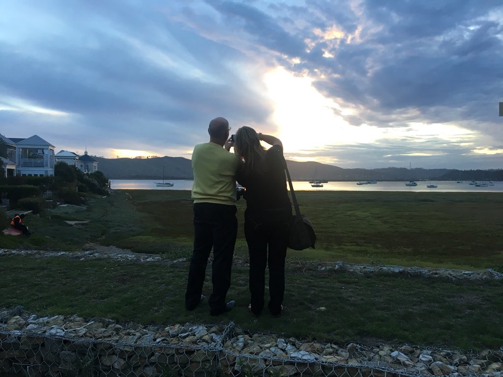 Sunset in Knysna... @Derek_Hanekom with @EllePhotos trying to catch the light. He’s quite the charmer at #KnysnaLitFest 😉