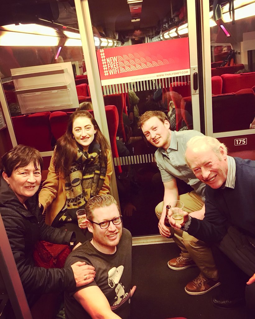 Damian_Dowling's tweet photo. Broken down @eurostar ...pushed into #Brussels to meet our delayed #Amsterdam connection. So 9hrs after leaving #London we’re celebrating the #SixNations crown on a @thalys_en floor 🙌☘️🎉🚂 https://t.co/F2b0zUfZtC