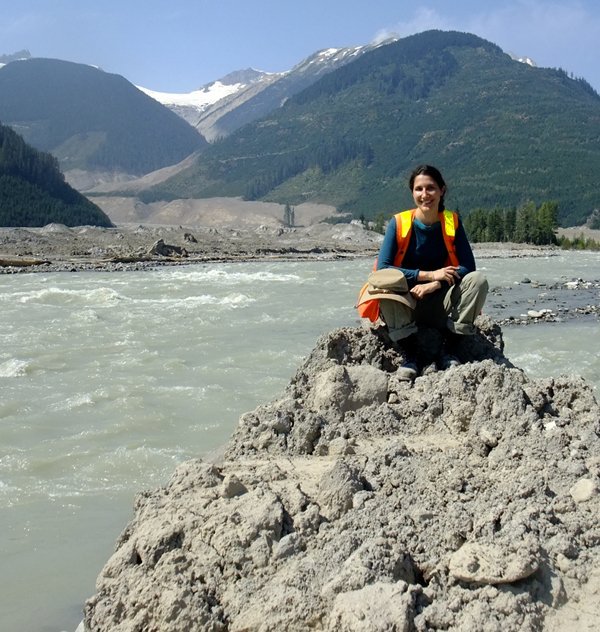 Muddy Mika in high-vis gear on a landslide deposit.
