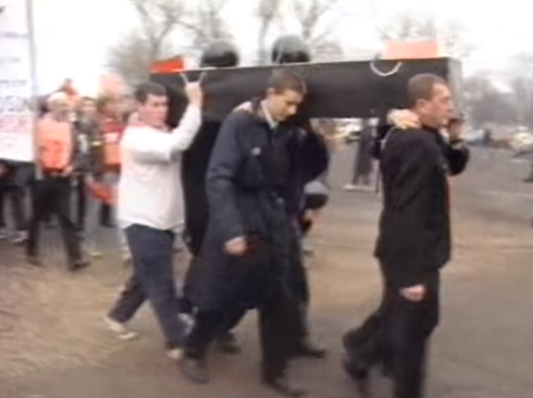 May 1998 - On the final day, expecting the final whistle to signal the death of the club, Rovers fans carry a ceremonial coffin to the ground and lay flowers and wreaths at the Town End.