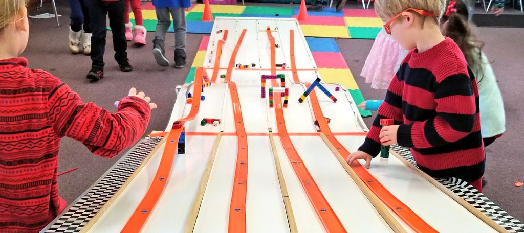 KyleHamstra's tweet photo. So awesome to see the racetrack enhancements they created. Even more amazing to see how #kindersCAN engineer ways to go "on top of, under, above, below," and through, doing whatever it takes to overcome all obstacles in their paths. #sciKP11 #ddestem #TheGreat5thGrRace https://t.co/8BhbNeebw0