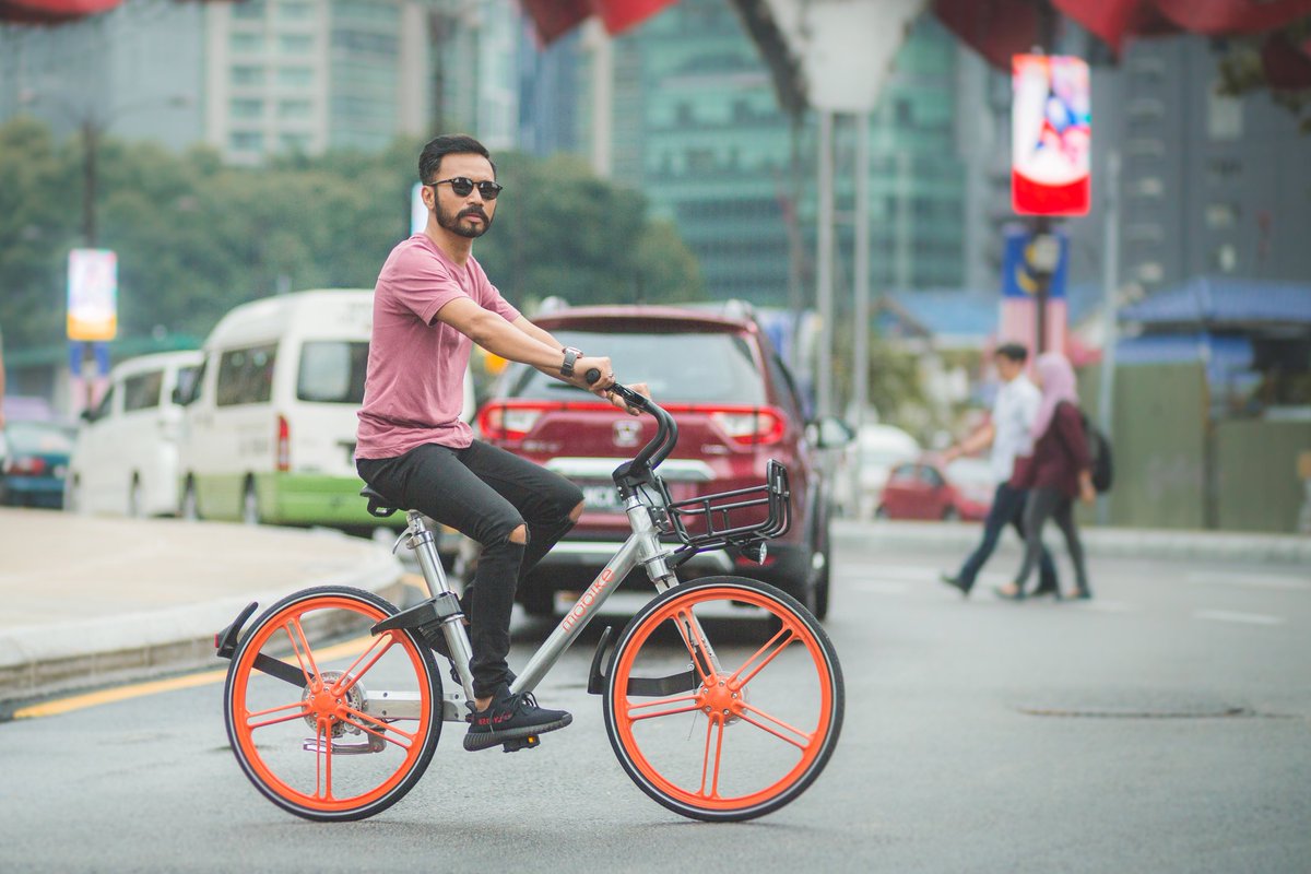 MobikeMY's tweet photo. We love this shot of our #firstrider @Wak_Doyok looking suave as he cycles through KL, and we just had to share. Do you have a favourite #ootd to Mobike in? #MobikeMovement https://t.co/ayl7YwSc4y