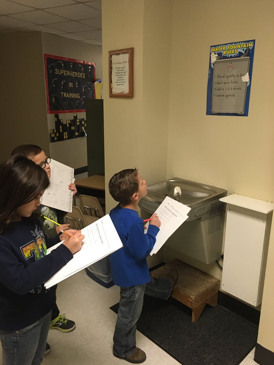 1st graders hunting for vowel patterns in the hallway text #readingiseverywhere #pesd32