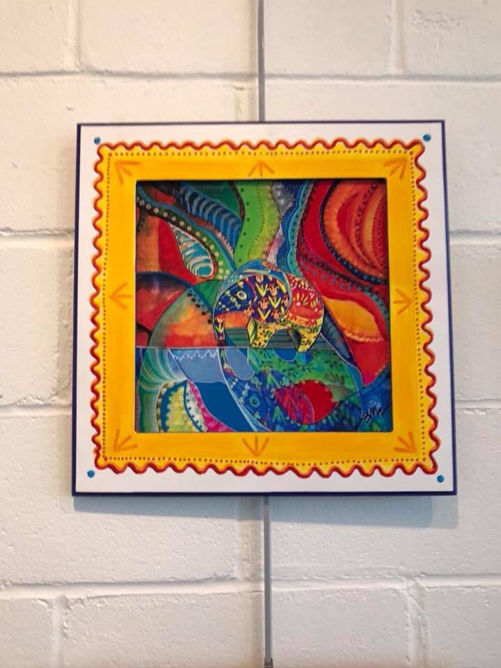 jaywintercollin's tweet photo. This mixed media - mixed artist piece with elements of my painted elephants and Brian Wilson’s colorful, magical abstract art married in a digital print on canvas that was then painted further and framed - won Judges Choice at the GFAA Mixed Media Show https://t.co/XWMviHHKvG